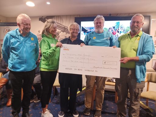 The Hengistbury head outdoors team collecting a large cheque donation